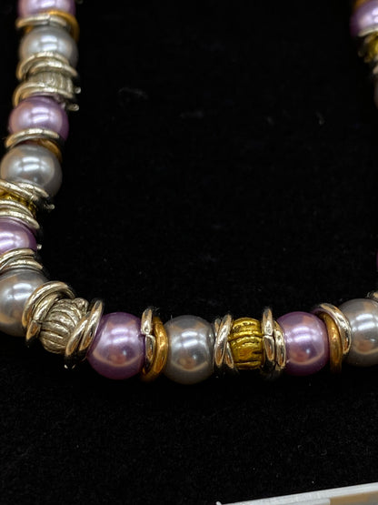 Elasticated Purple and Silver Bead Bracelet with Gold and Silver Metal Rings